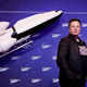Elon Musk is photographed with a white miniature rocket in the background.